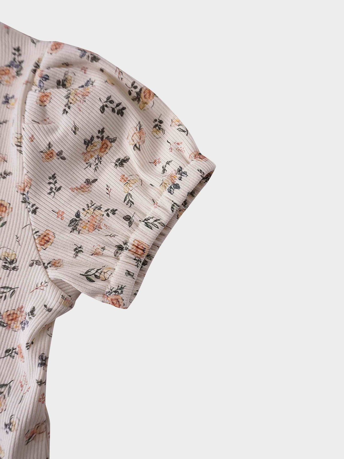 Petit Floral Dress- Short Bubble Sleeve with hand-painted pink flowers on off-white ribbed fabric.