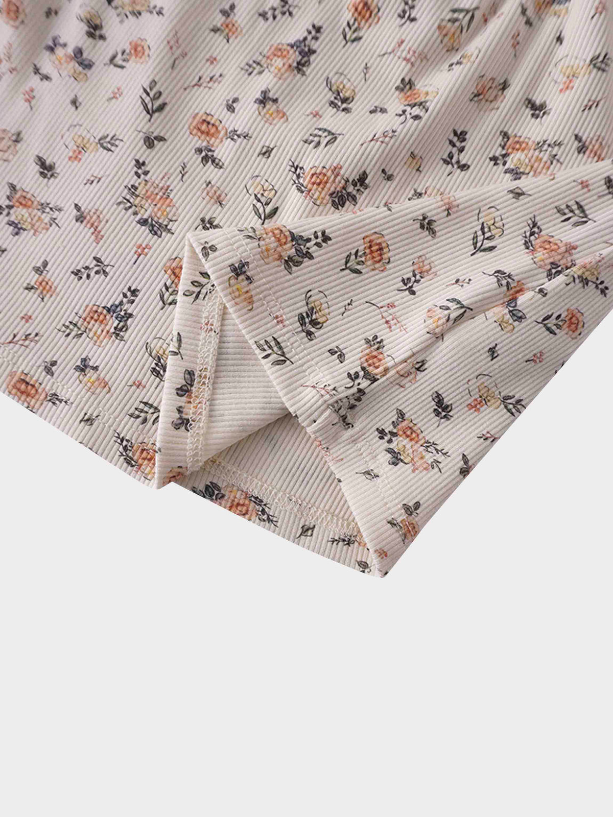 Petit Floral Dress: off-white ribbed fabric with hand-painted pink flowers, buds, and leaves.