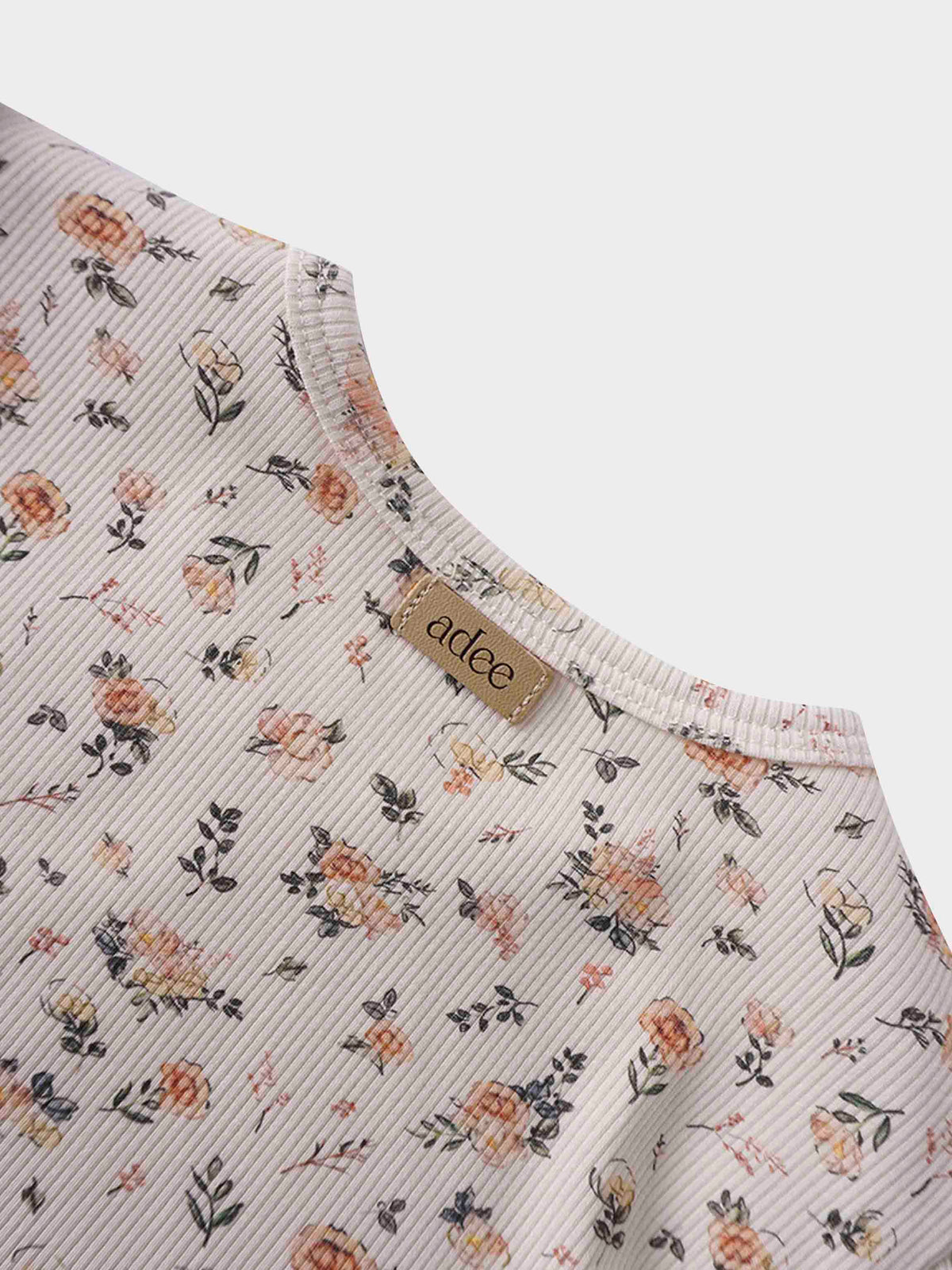 Petit Floral Dress with short bubble sleeves on off-white fabric, hand-painted pink flowers and leaves.