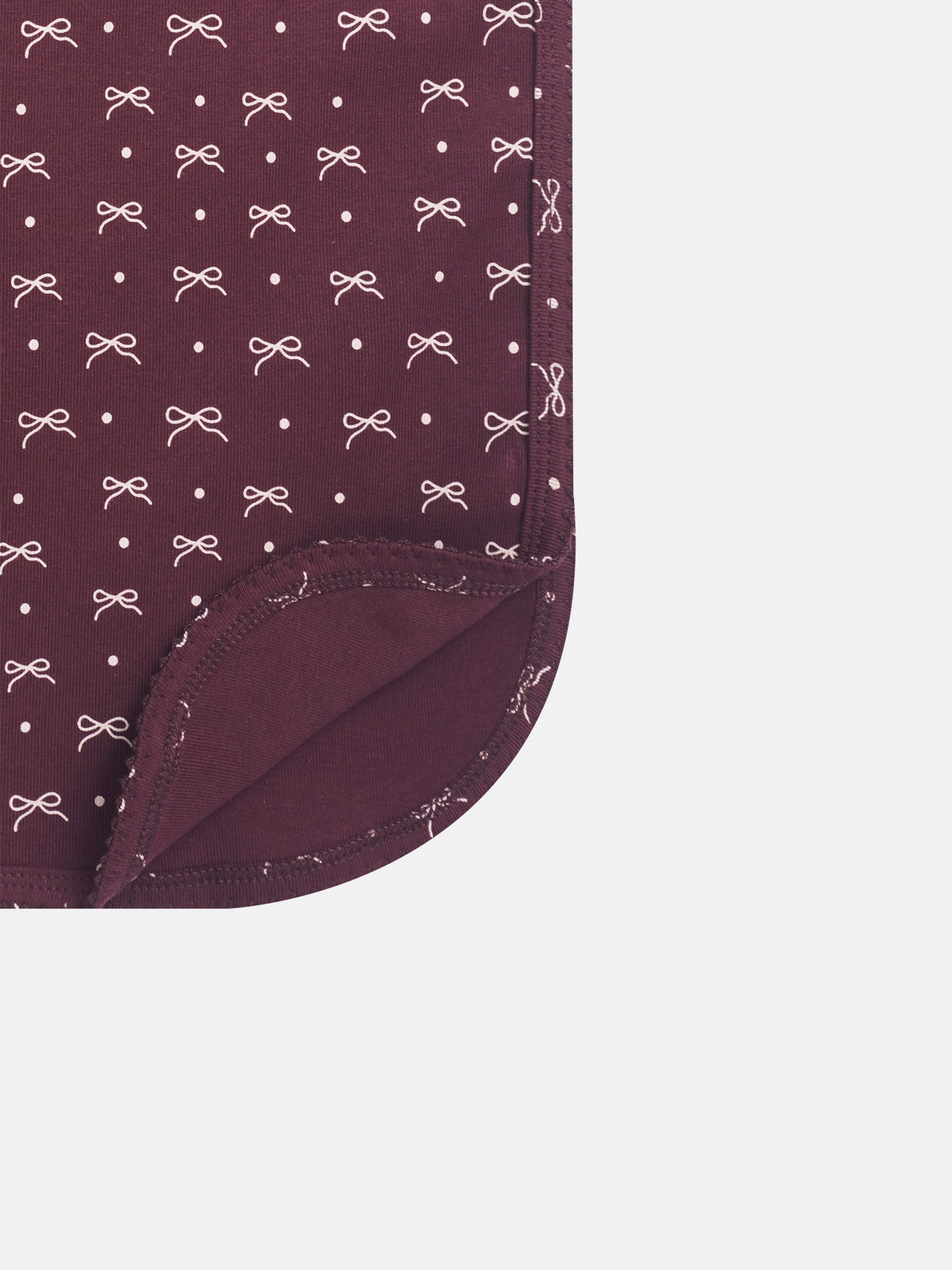 Burgundy bow blanket for girls swaddle blanket with white bows and dots, close-up corner view
