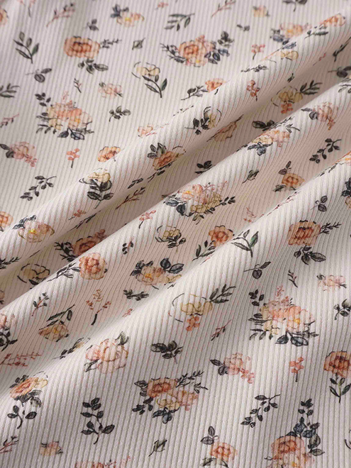 Petit Floral Dress print on off-white fabric with hand-painted pink flowers, buds and leaves.
