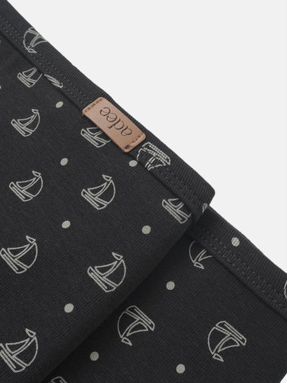 Harbor Dot Blanket by Adee, boys swaddle blanket in navy with light gray sailboats pattern and leather tag.