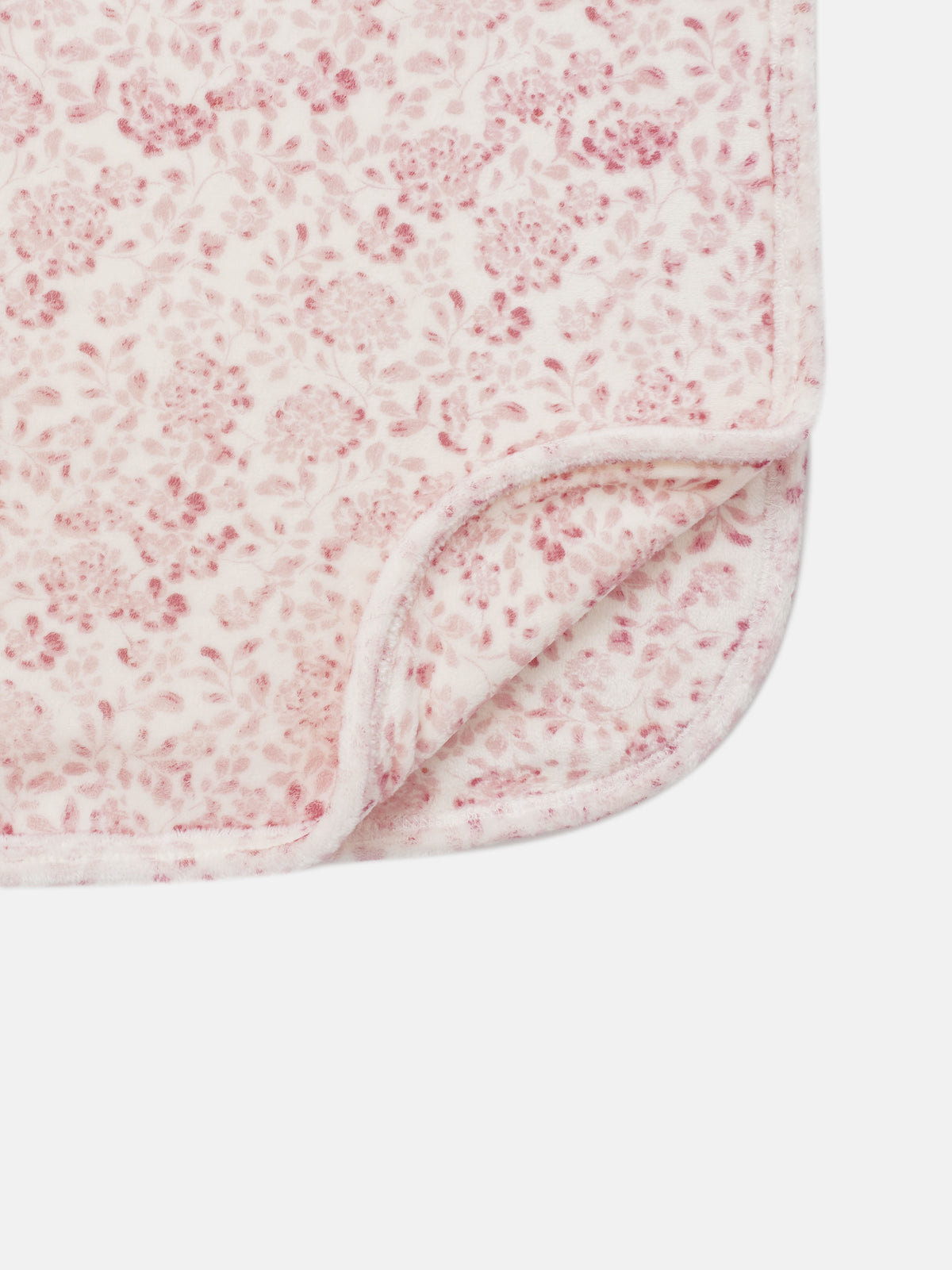 Two Tone Floral Blanket for girls; soft pink floral pattern on white plush fleece with a stitched edge