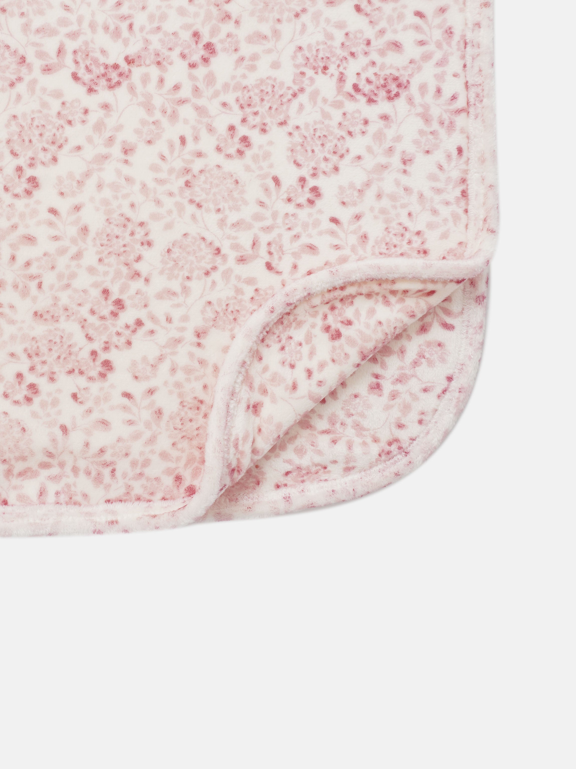 Two Tone Floral Blanket for girls; soft pink floral pattern on white plush fleece with a stitched edge
