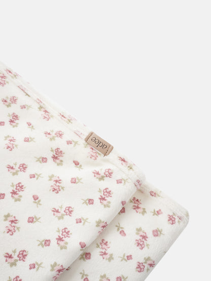 Tiny Blossom Blanket swaddle by Adee, white fabric with pink floral print.