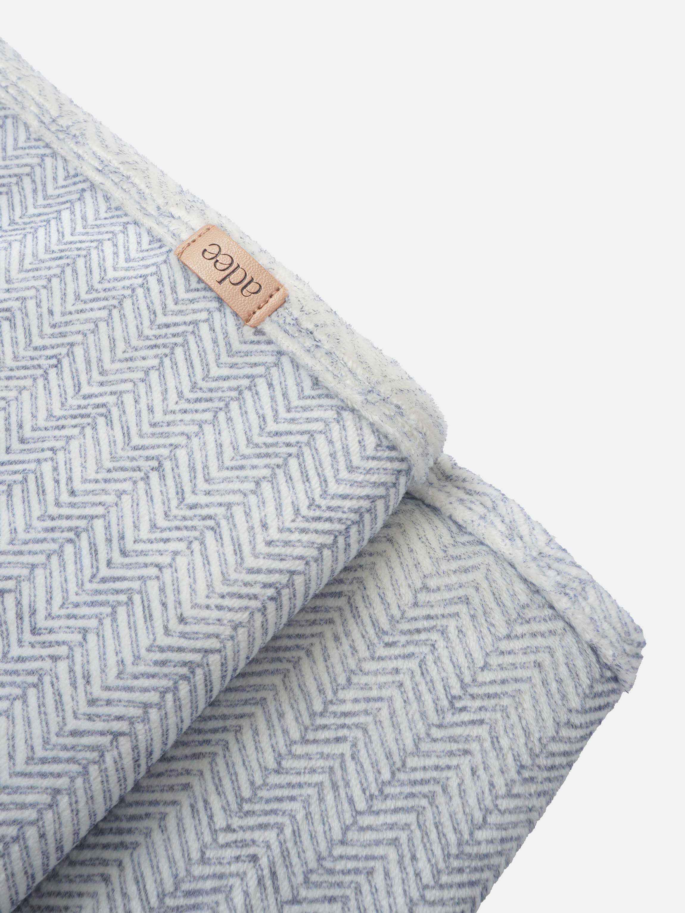 Heritage Herringbone Blue layette set for boys by Adee; soft chevron fabric with tan leather brand patch
