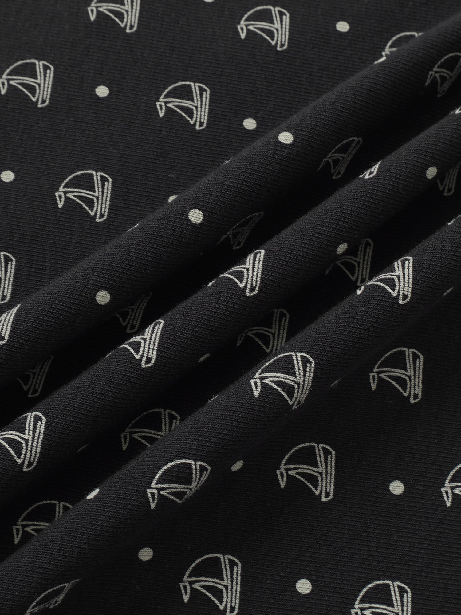 Harbor Dot Blanket, navy fabric with white stroller-outline prints and dots.