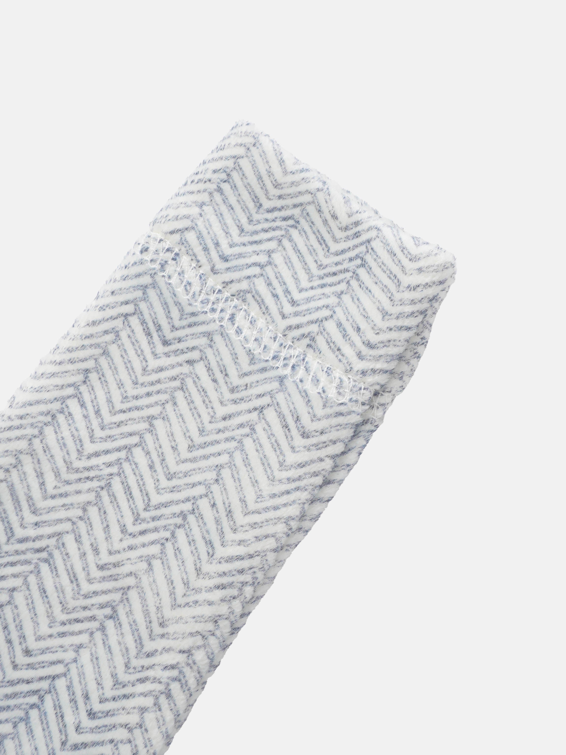 Adee Heritage Herringbone Blue layette set fabric swatch with blue and white chevron pattern.
