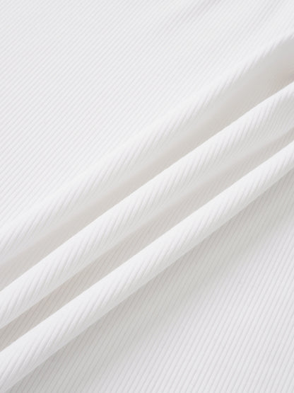 Legacy Stitch White layette set fabric close-up; ribbed cotton.