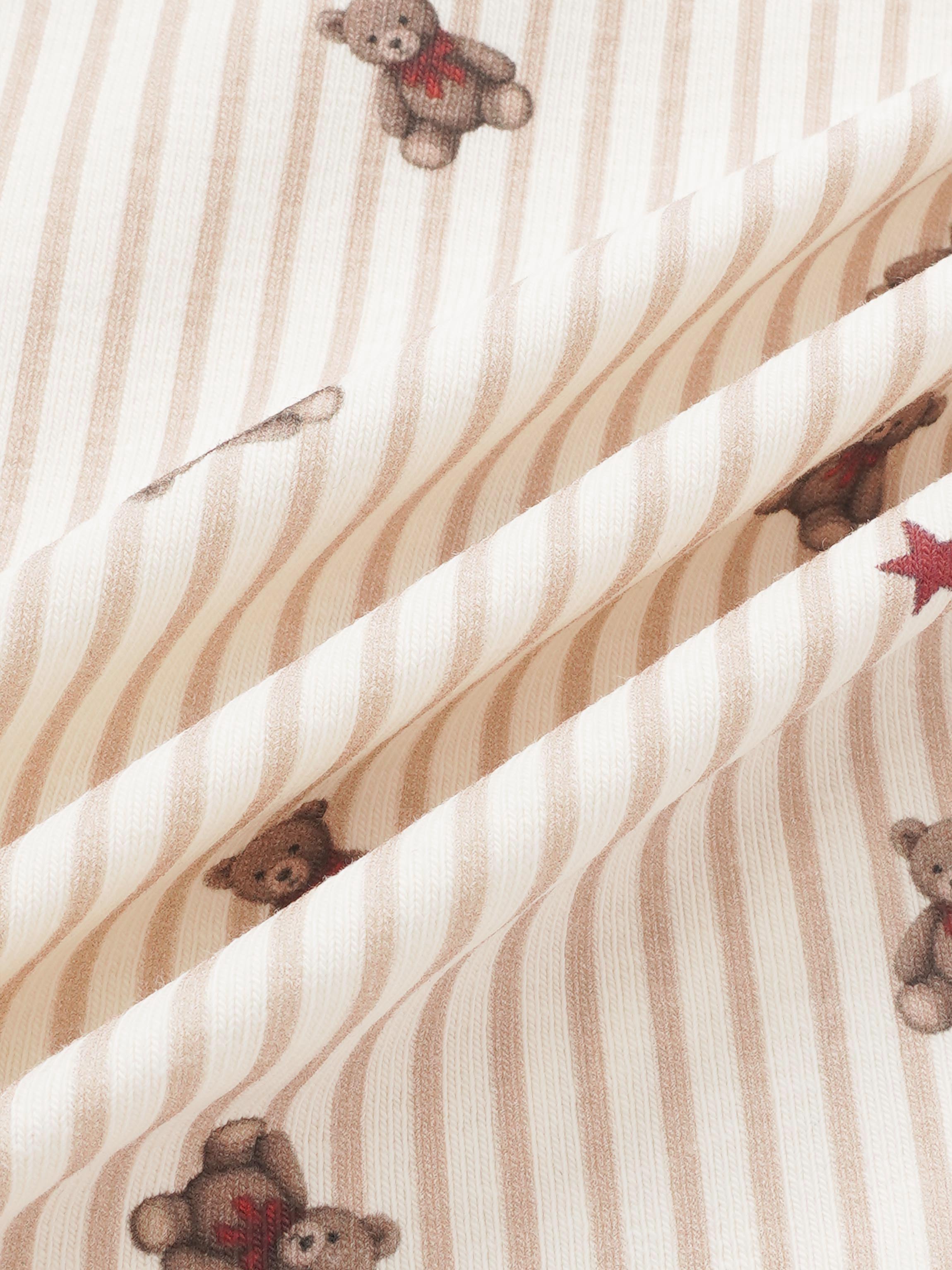 Girls striped bear pajamas by Adee; beige and white stripes with brown teddy bear prints and red accents.