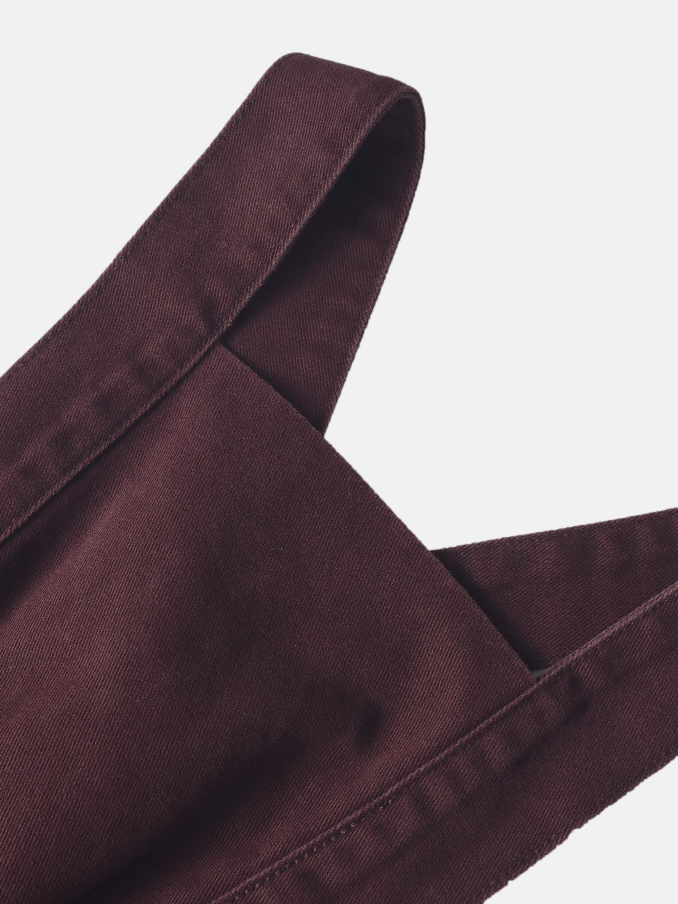 Denim jumper dress for girls in burgundy with stitched straps.