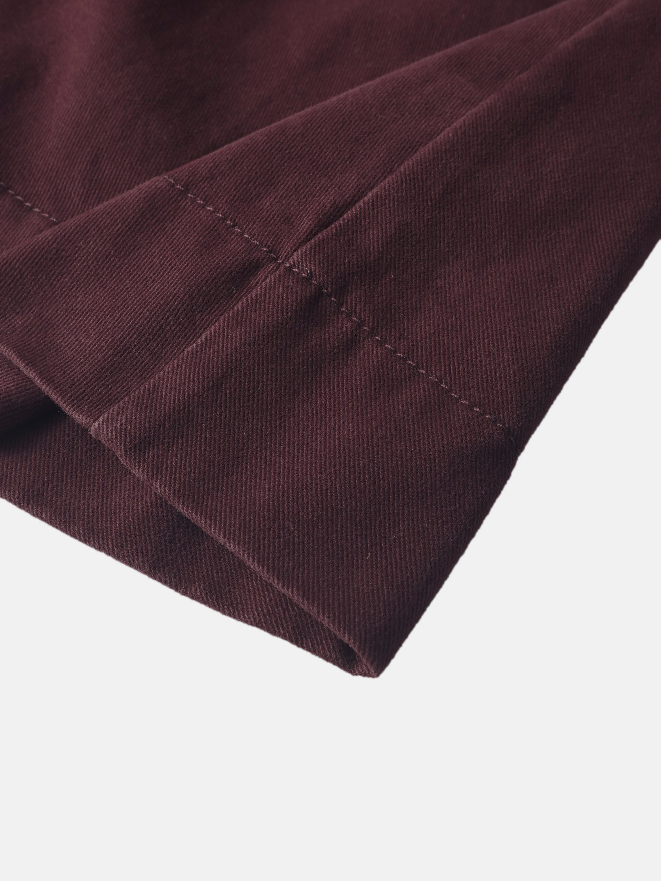 Denim jumper dress for girls, burgundy by Adee, with visible topstitching.