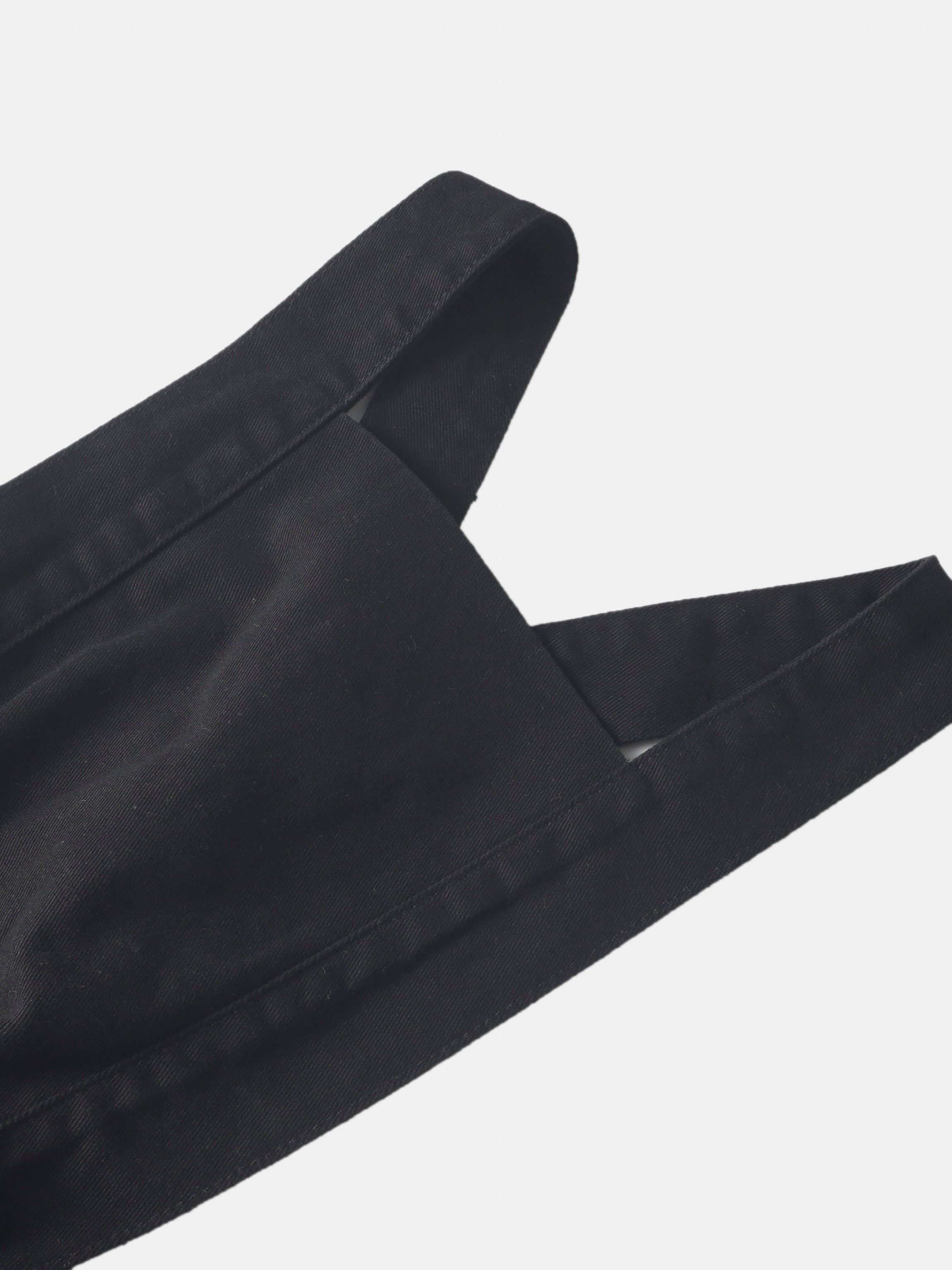 Black denim jumper dress for girls with wide straps and visible stitching