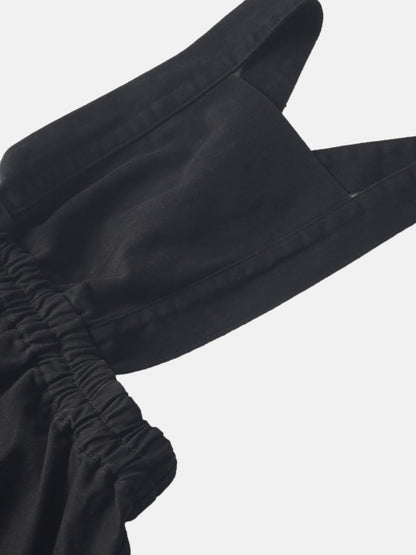 Denim jumper dress with elasticized waist in black for girls