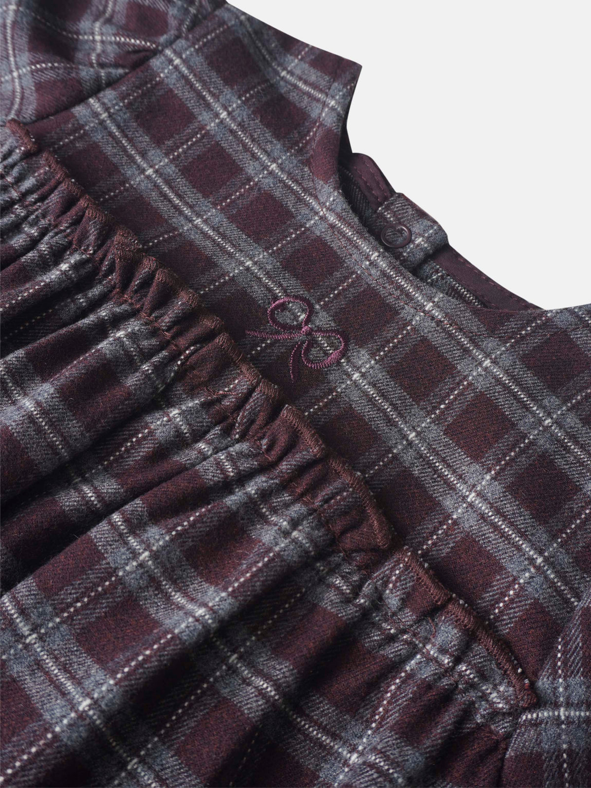 Plaid burgundy girls romper dressy by Adee; close-up shows plaid fabric with elastic waist.
