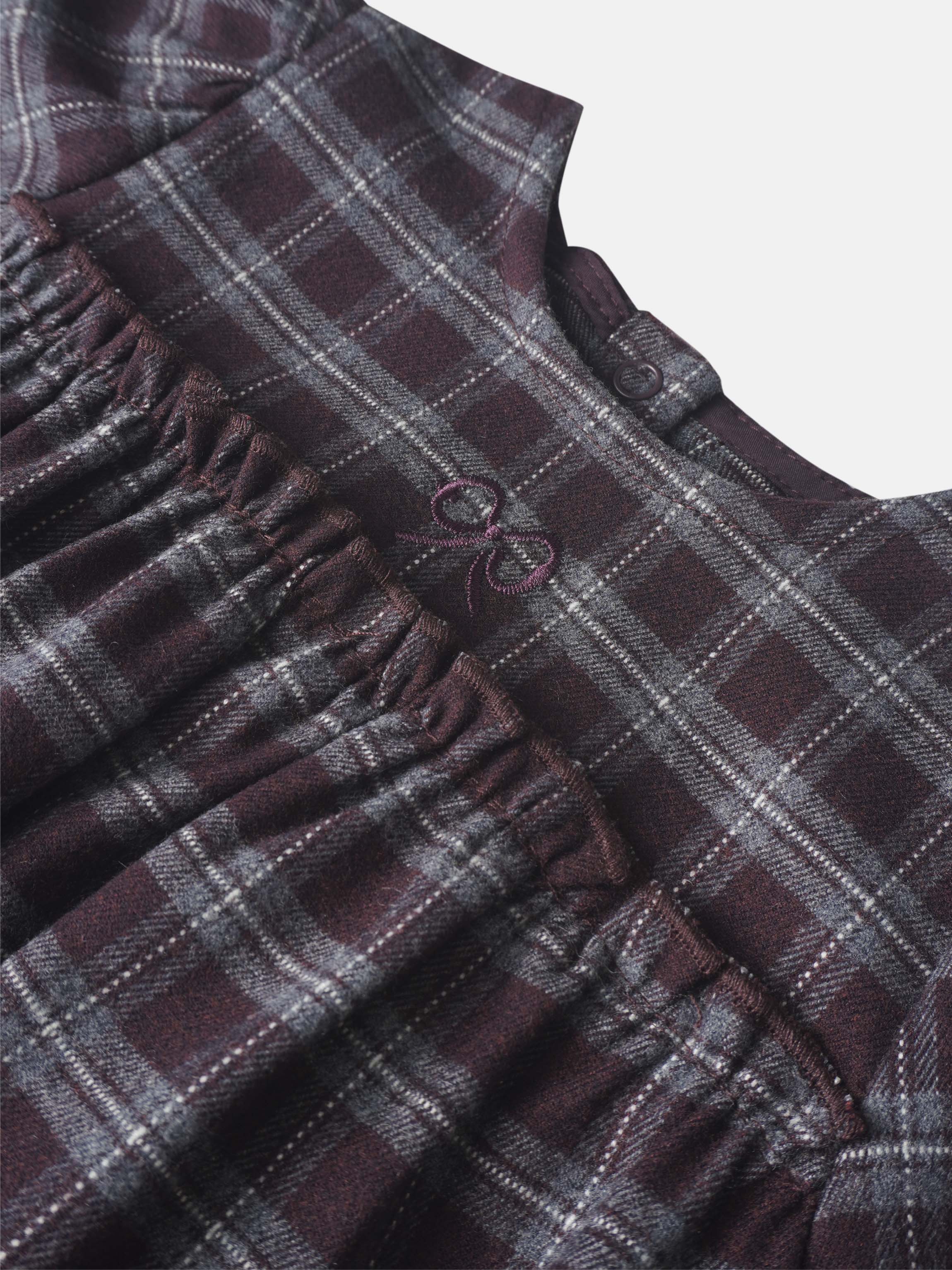 Plaid burgundy girls romper dressy by Adee; close-up shows plaid fabric with elastic waist.