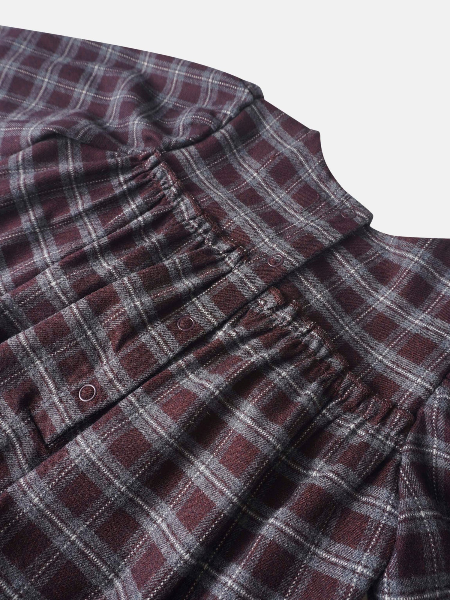 Plaid burgundy girls romper by Adee; dressy style with front snaps in soft woven fabric.