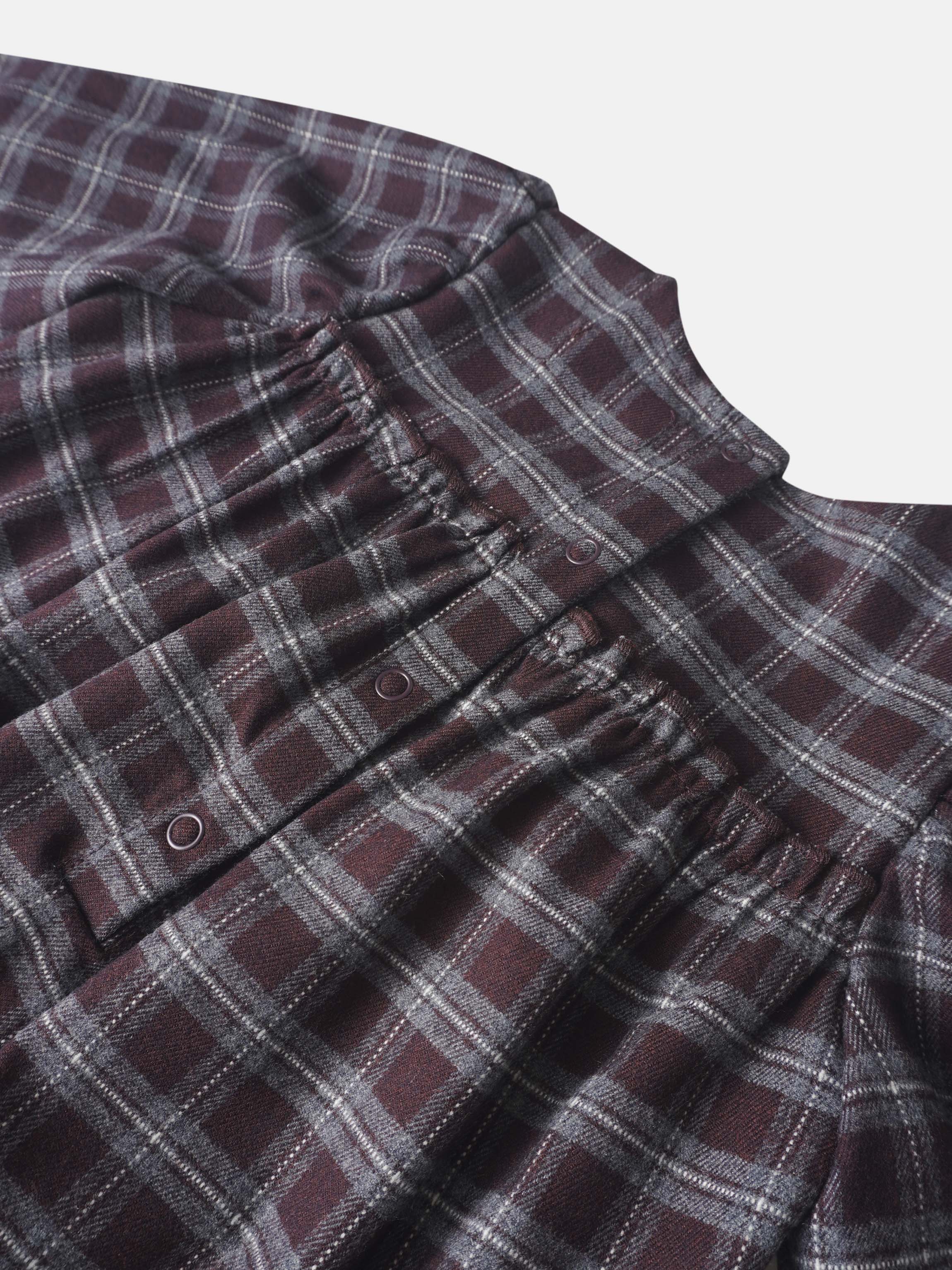Plaid burgundy girls romper by Adee; dressy style with front snaps in soft woven fabric.