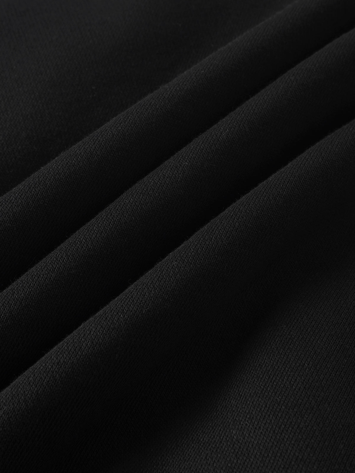 Fur Lined Sweatshirt by Adee in black; close-up of soft knit fabric.