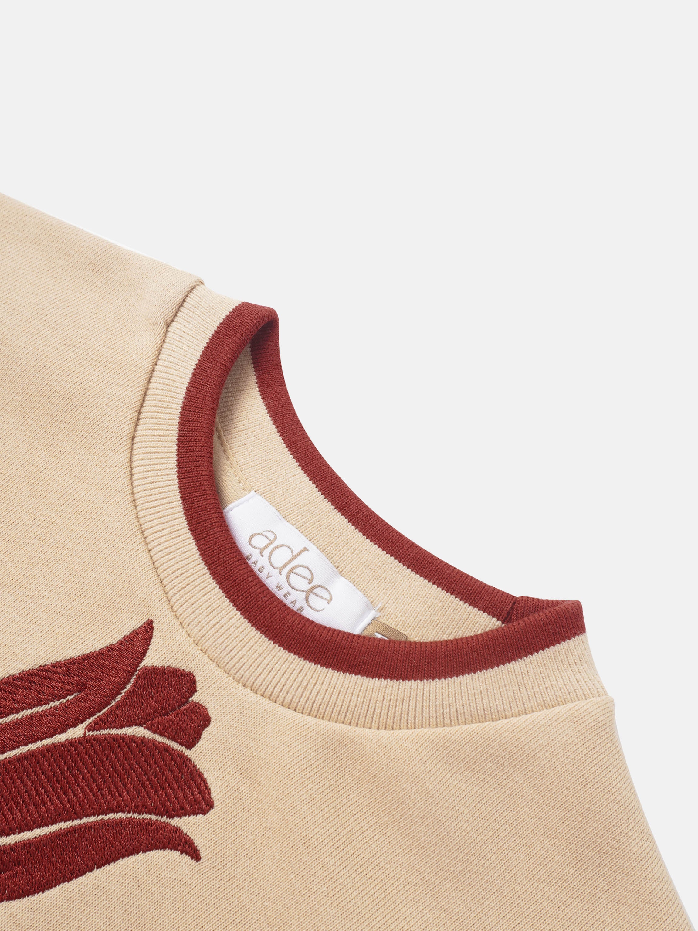 Embroidered Tulip Sweatshirt for girls by Adee, beige knit with red neckline trim and tulip motif.