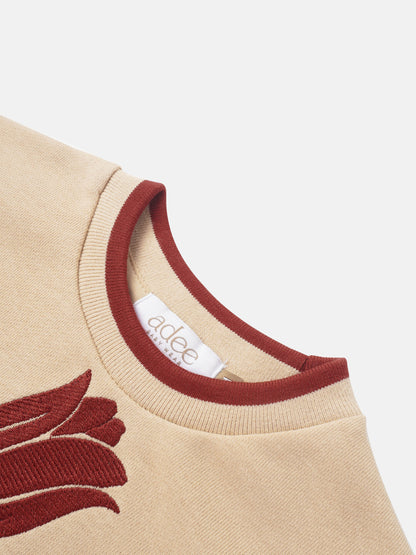 Embroidered Tulip Sweatshirt for girls by Adee, beige knit with red neckline trim and tulip motif.