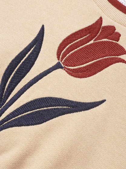 Embroidered tulip sweatshirt for girls by Adee; beige knit fabric with red flower and navy leaves