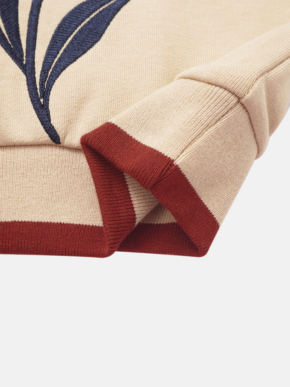 Embroidered Tulip Sweatshirt for girls; beige knit with navy tulip embroidery and red rib trim