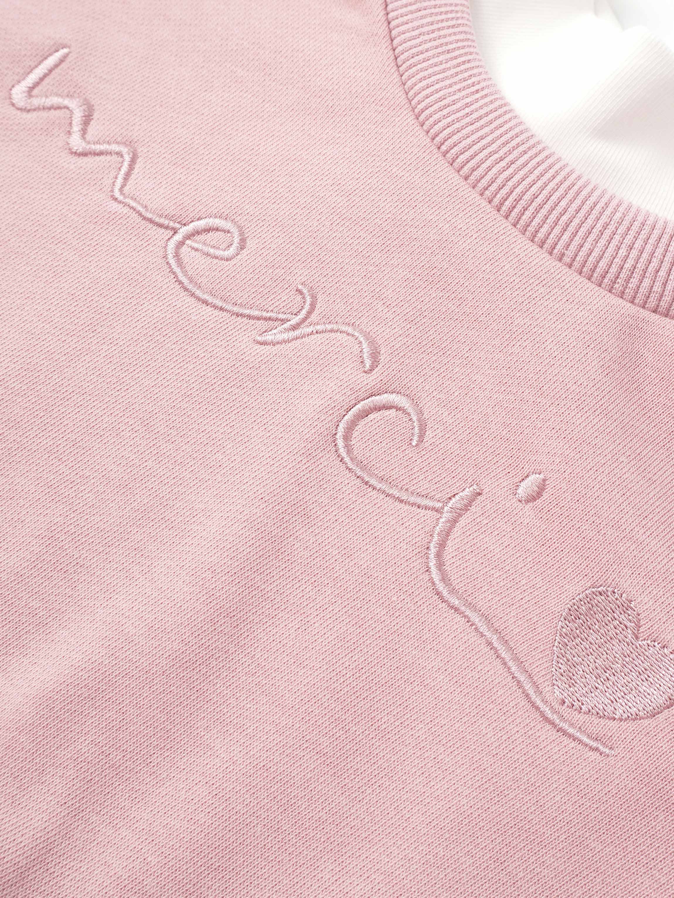 Girls pink Adee contrast mock neck sweatshirt with embroidered script.