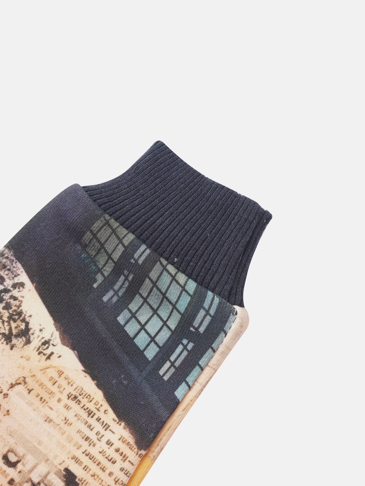 Skyscraper Sweatshirt by Adee; boys top with navy ribbed cuffs and patchwork panels in teal grid and newspaper print.