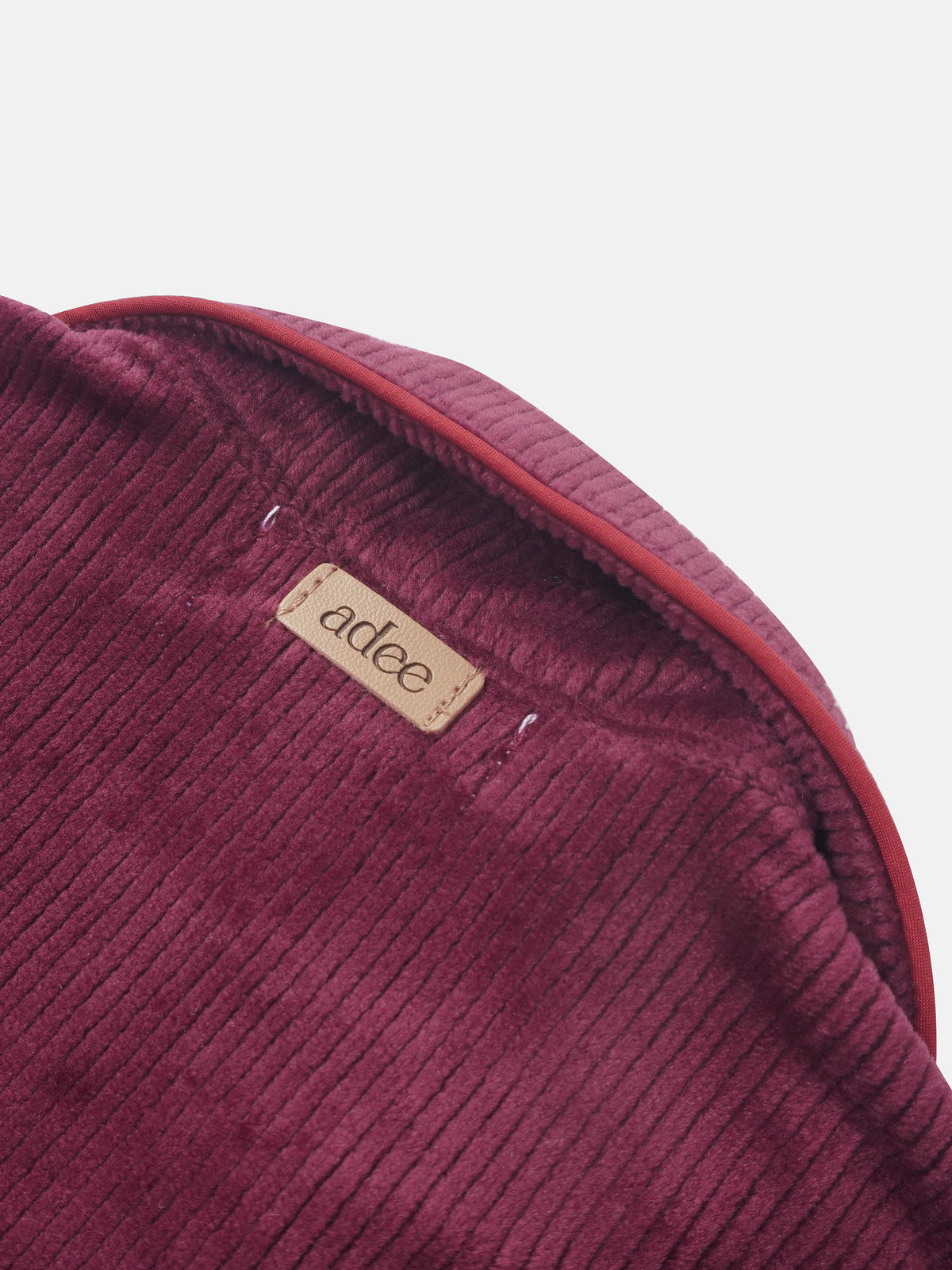 Ribbed velour girls pajamas in burgundy with visible Adee brand label