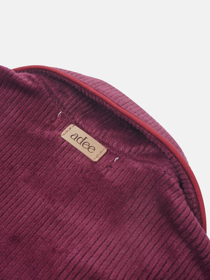 Ribbed velour girls pajamas in burgundy with visible Adee brand label