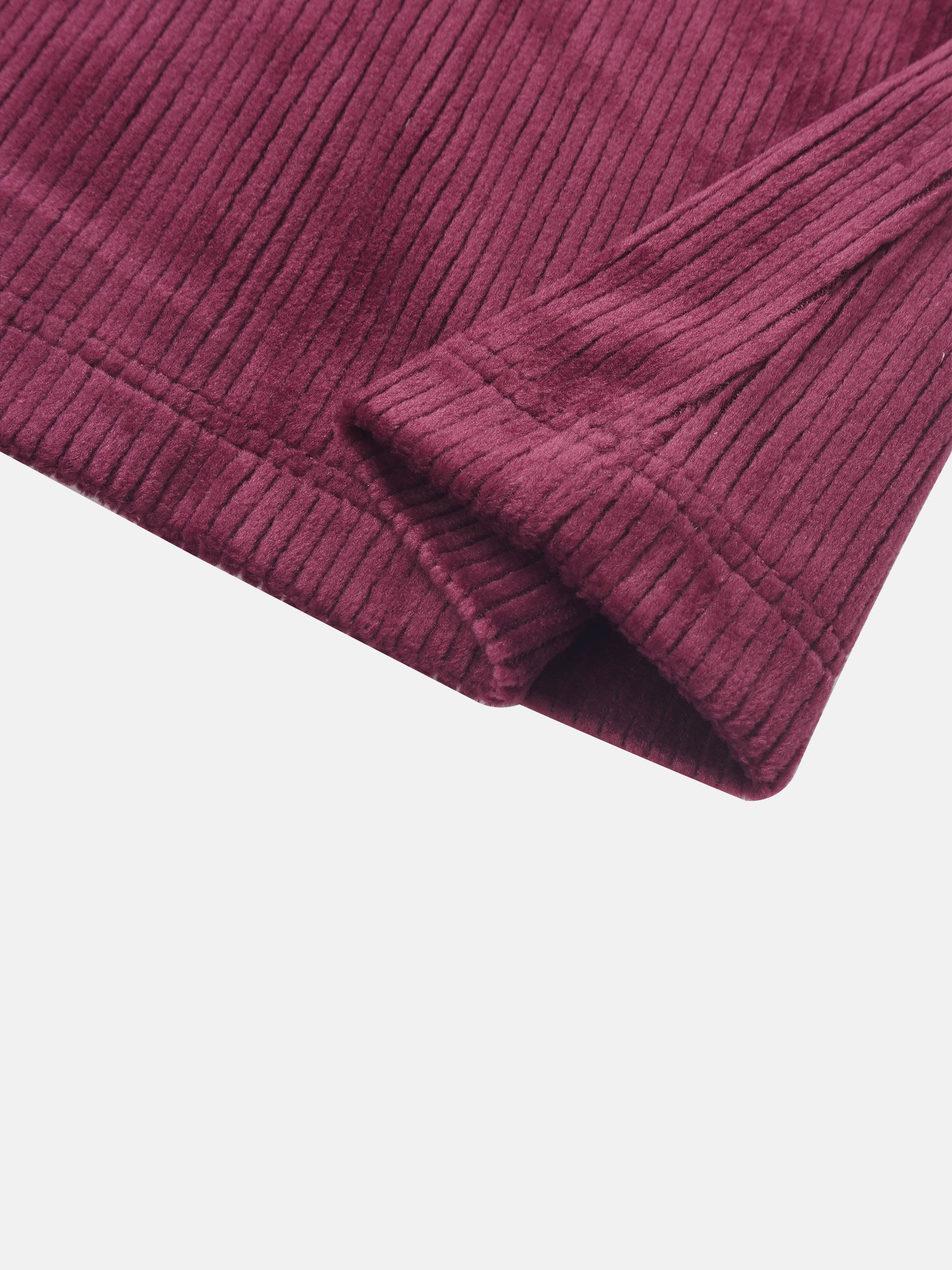 Ribbed velour burgundy girls pajamas fabric close-up with cuff detail.