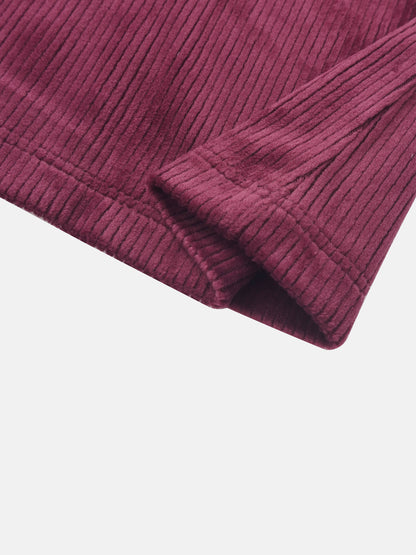 Ribbed velour burgundy girls pajamas fabric close-up with cuff detail.