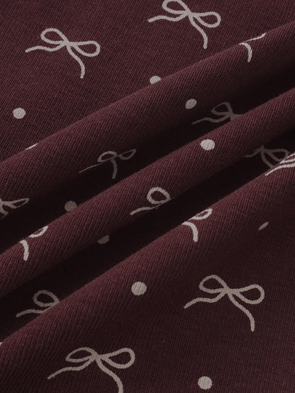 Burgundy Bow Set fabric by Adee; maroon knit with white bows and polka dots for little girls.