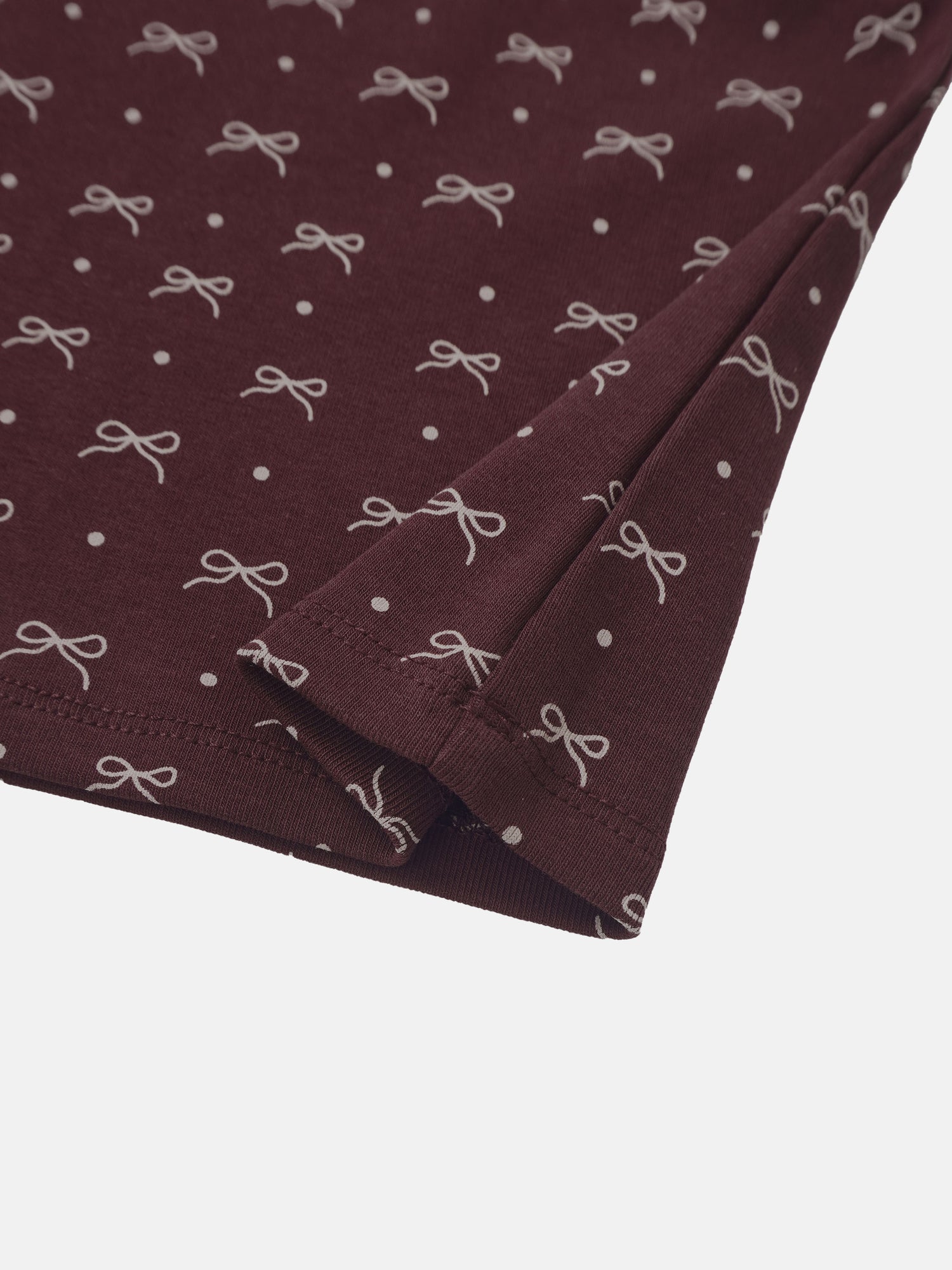 Burgundy Bow T‑Shirt for girls with white bow prints and polka dot accents.