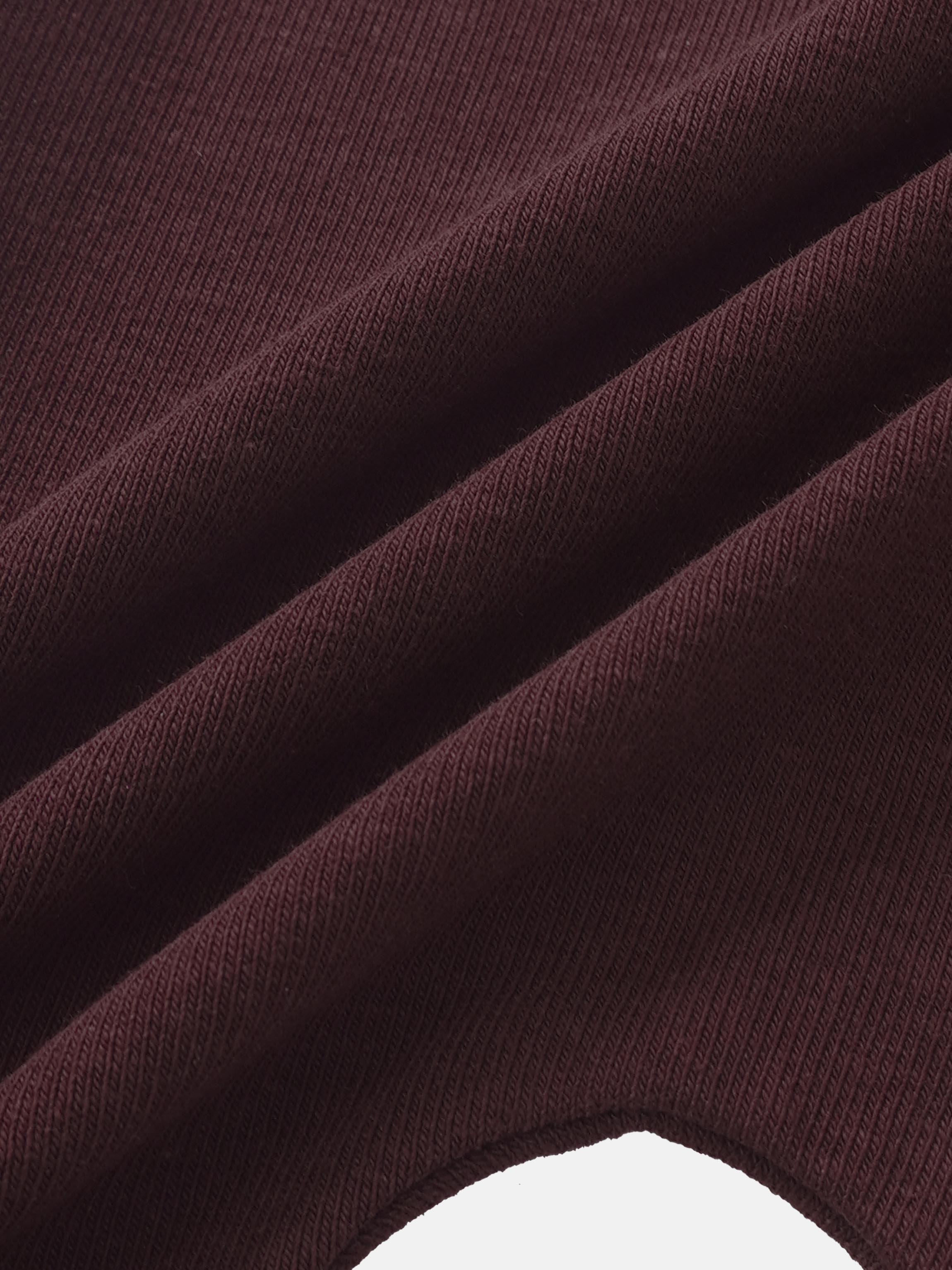 Overalls burgundy ribbed fabric close up texture detail