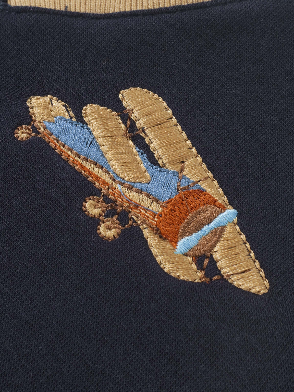 Embroidered Jet Sweatshirt by Adee with multicolor stitched patch on navy fabric.