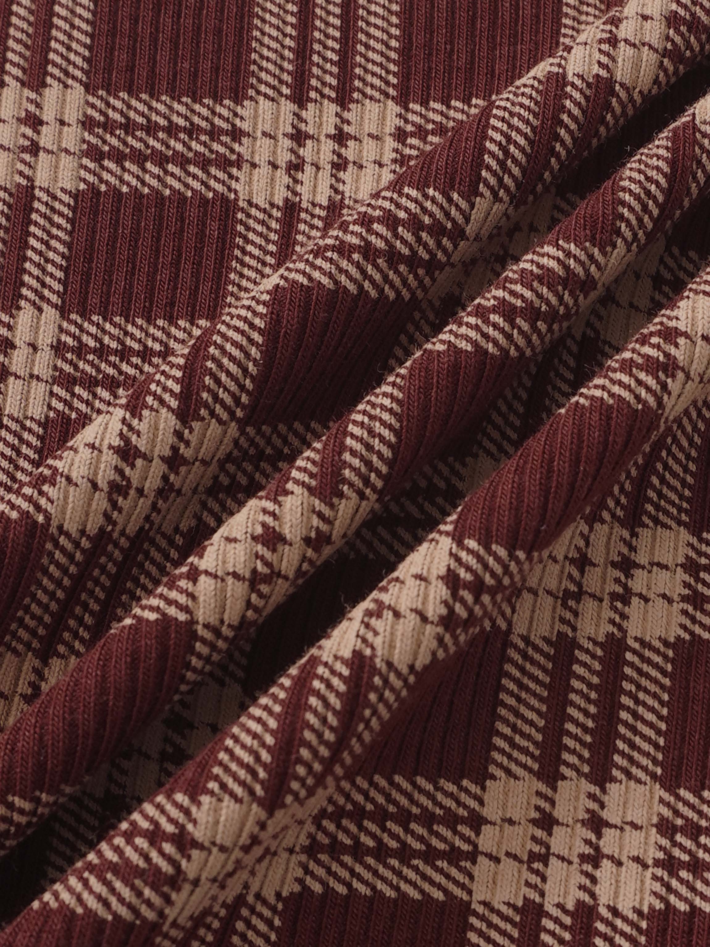 Girls burgundy plaid pajama fabric by Adee, close-up knit pattern