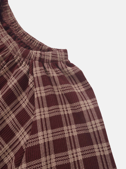 Plaid burgundy nightgown fabric close-up with elastic neckline