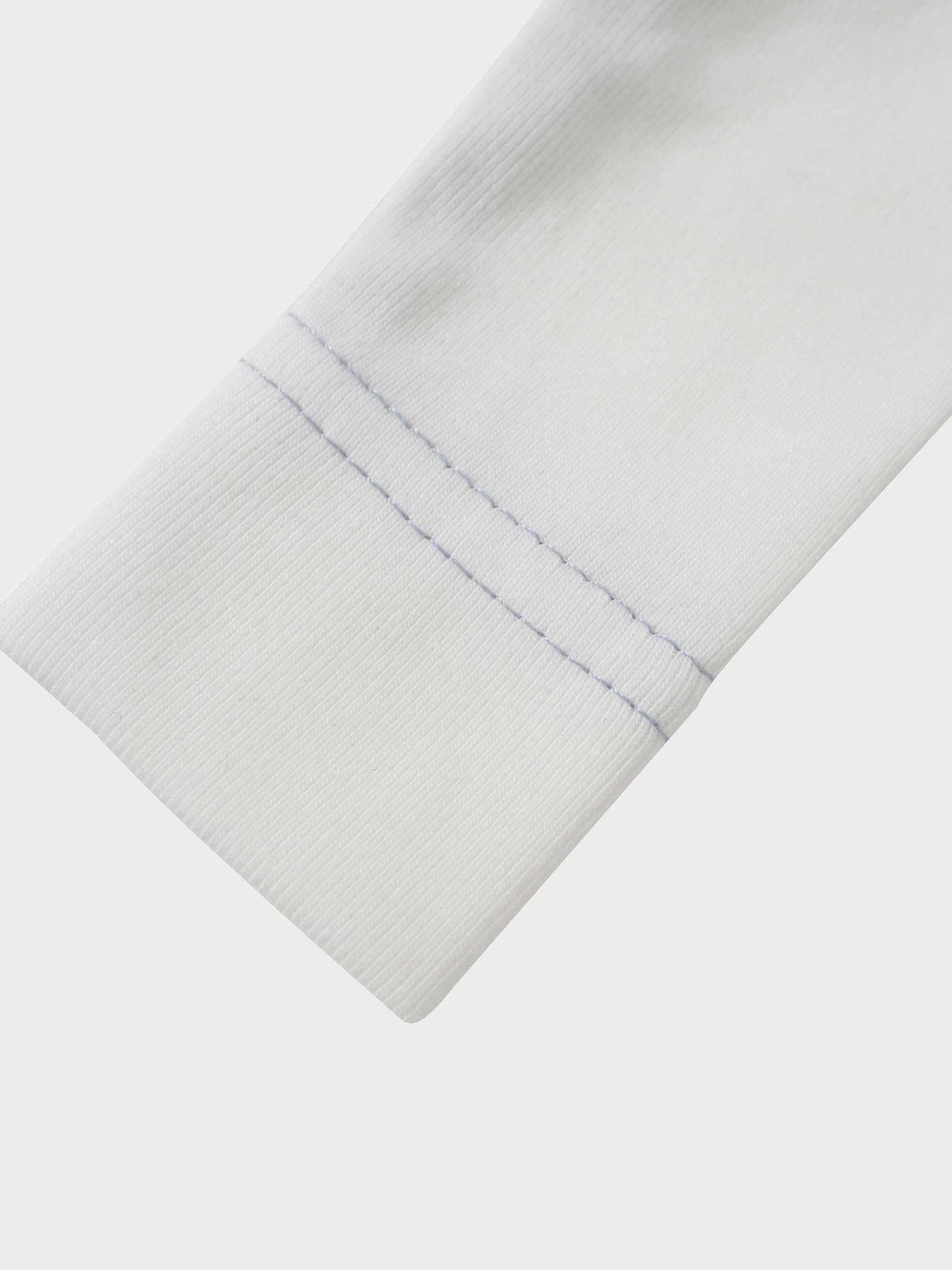 Mini Gallery Stretchy - Blue, white jumpsuit sleeve with blue stitching.