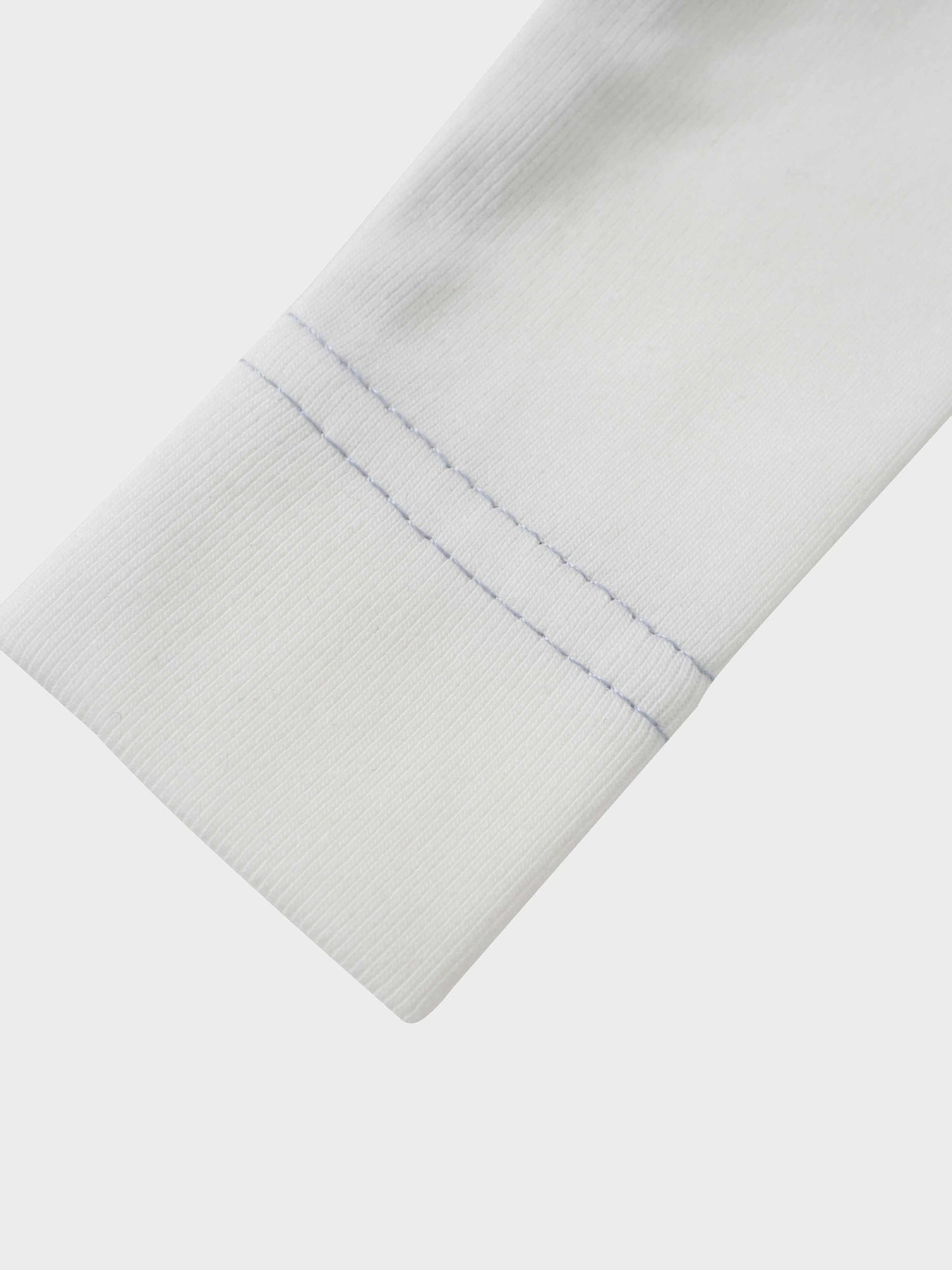 Mini Gallery Stretchy - Blue, white jumpsuit sleeve with blue stitching.