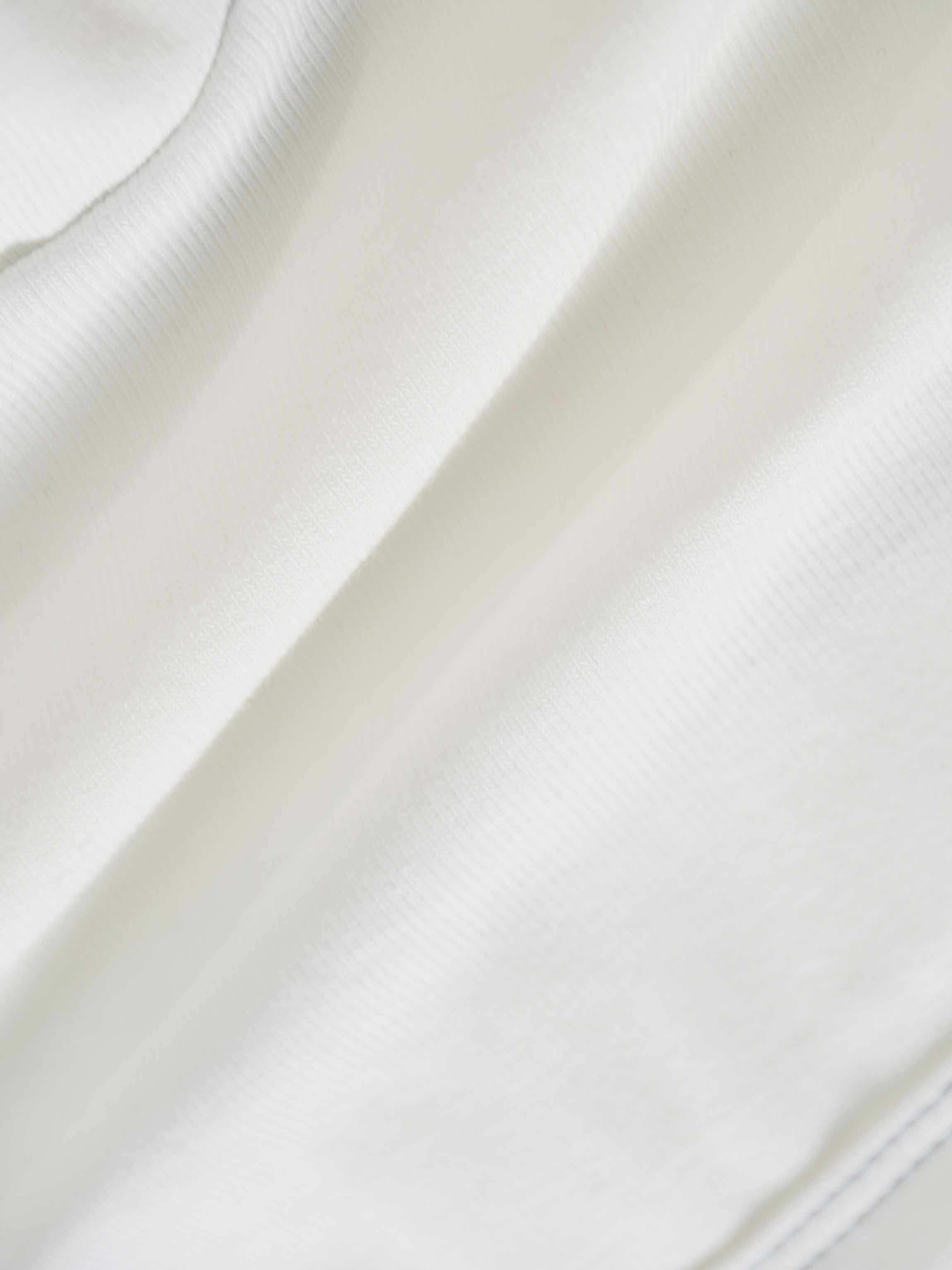 Mini Gallery Stretchy white fabric close-up for Boys Stretchies apparel