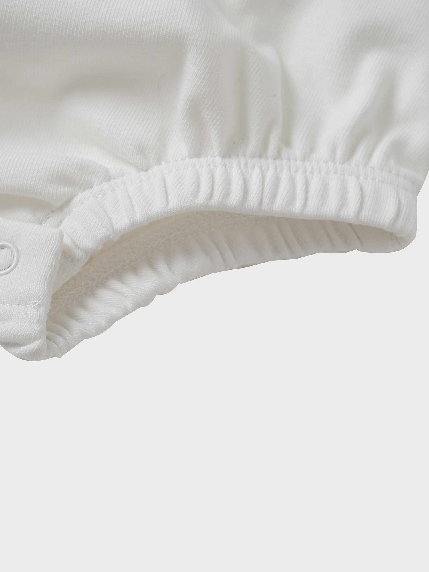 Mini Gallery Romper for baby boys in white with elastic leg openings