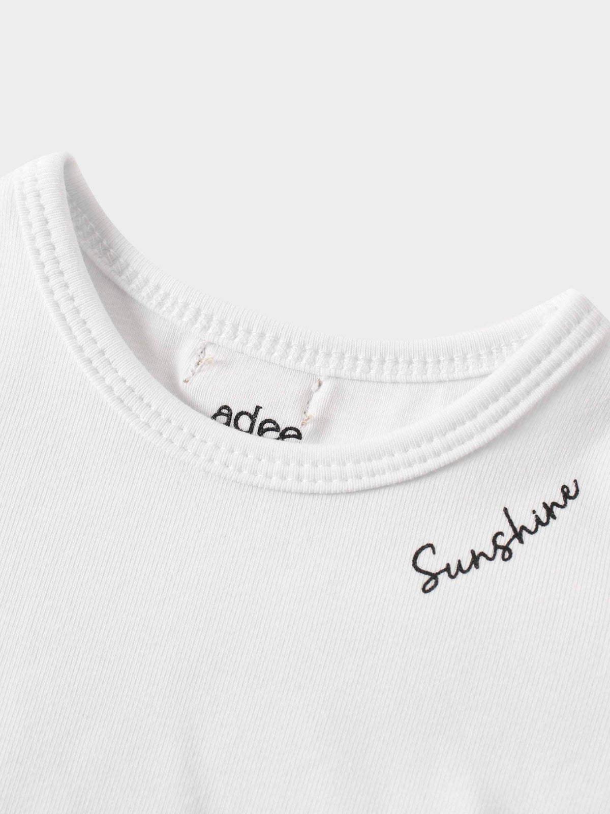 Detail of girls shirts with &