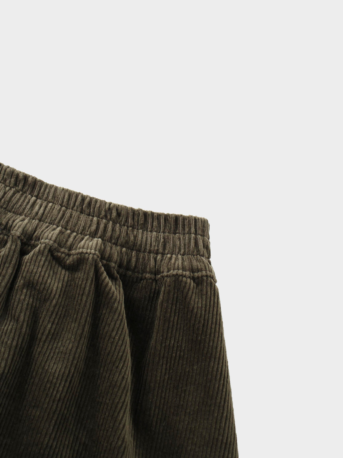 Forest green corduroy skirt for girls with elastic waistband and gentle gathers, A-line silhouette