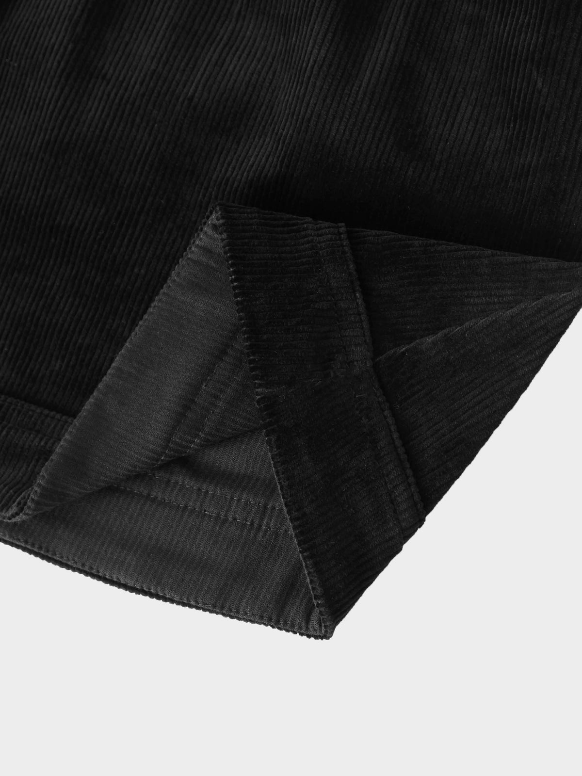 Corduroy skirt for girls in black by Adee; textured fabric with folded hem.