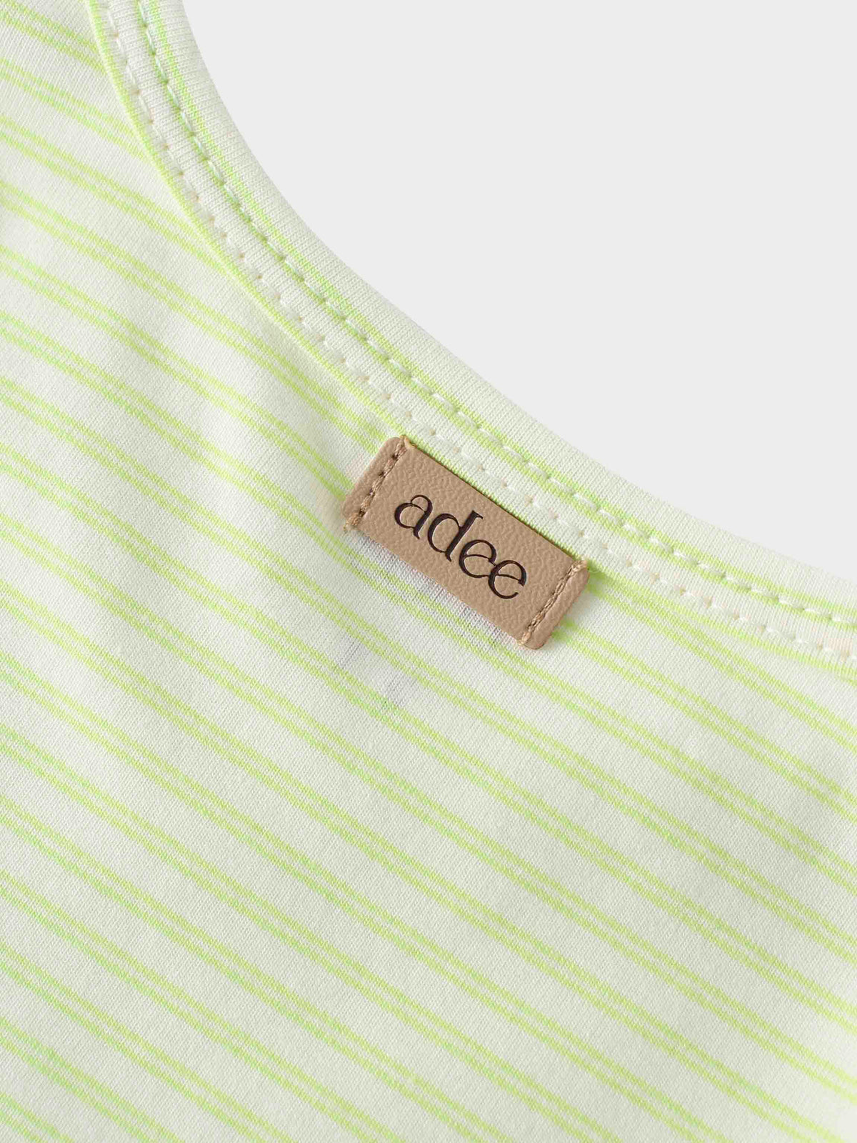 Label on yellow striped t-shirt