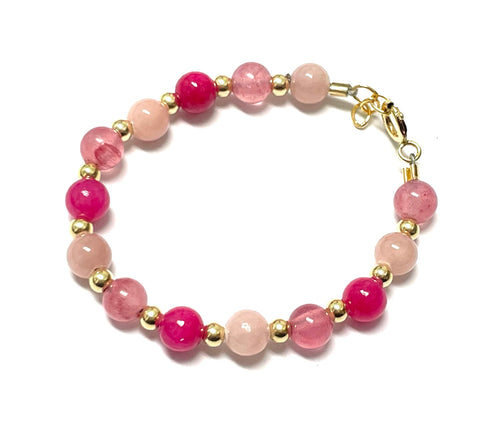 Three Color Bracelet with pink, rose, and fuchsia beads, gold spacers, and a clasp
