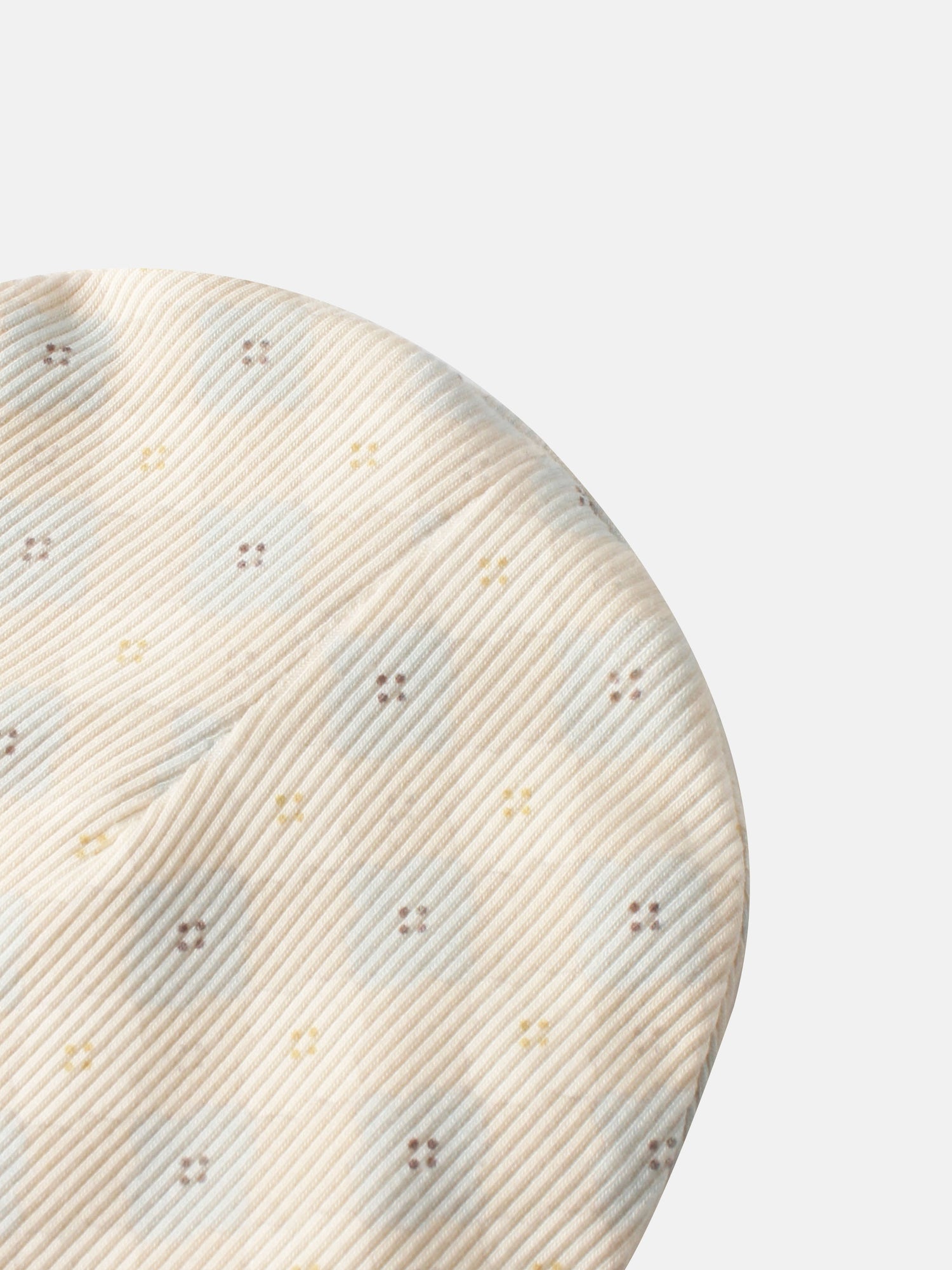 Little Button Blue layette set for boys, beige striped fabric close-up