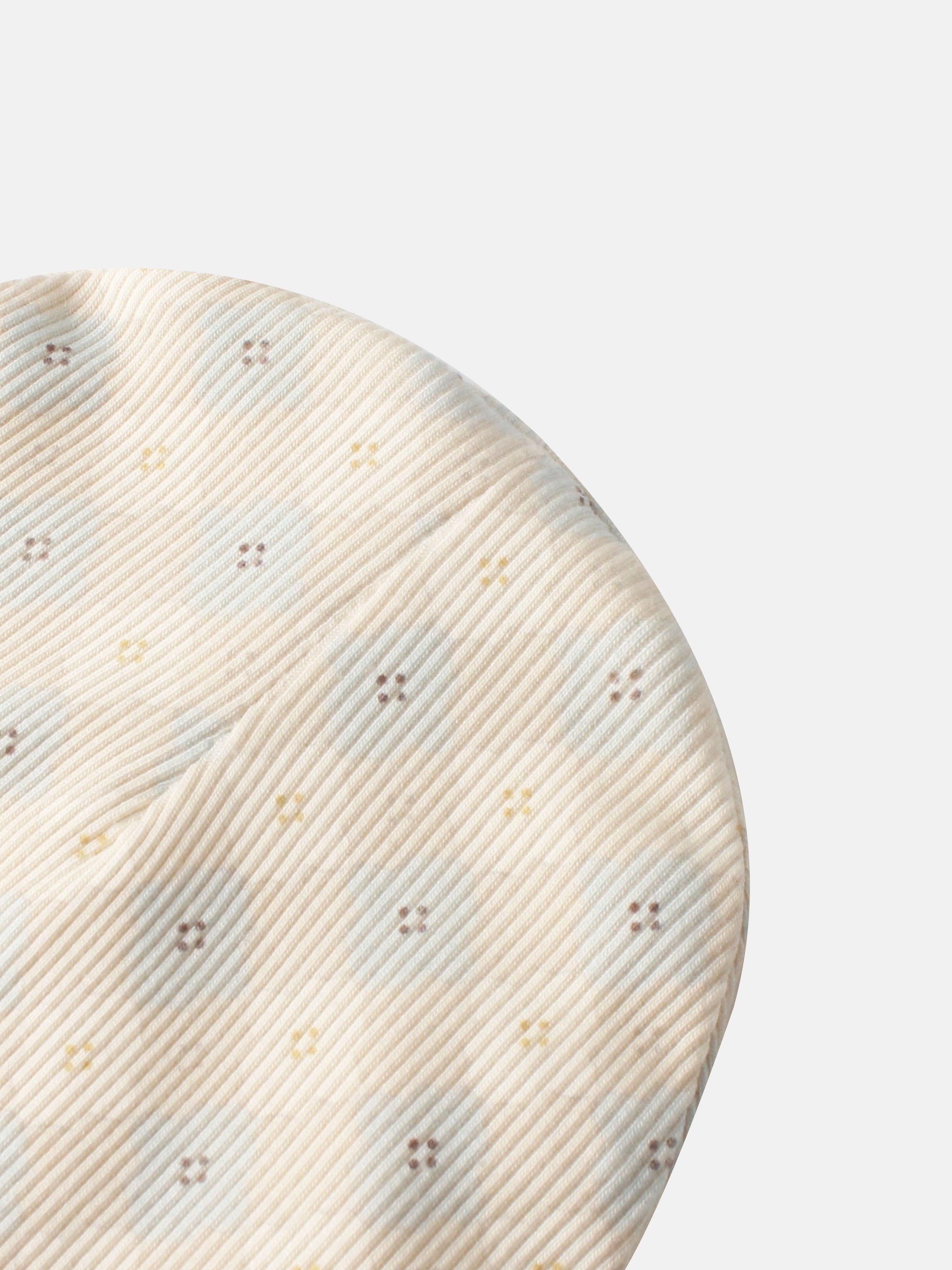 Little Button Blue layette set for boys, beige striped fabric close-up
